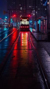 photo of tram beside waiting station during nightt... wallpaper