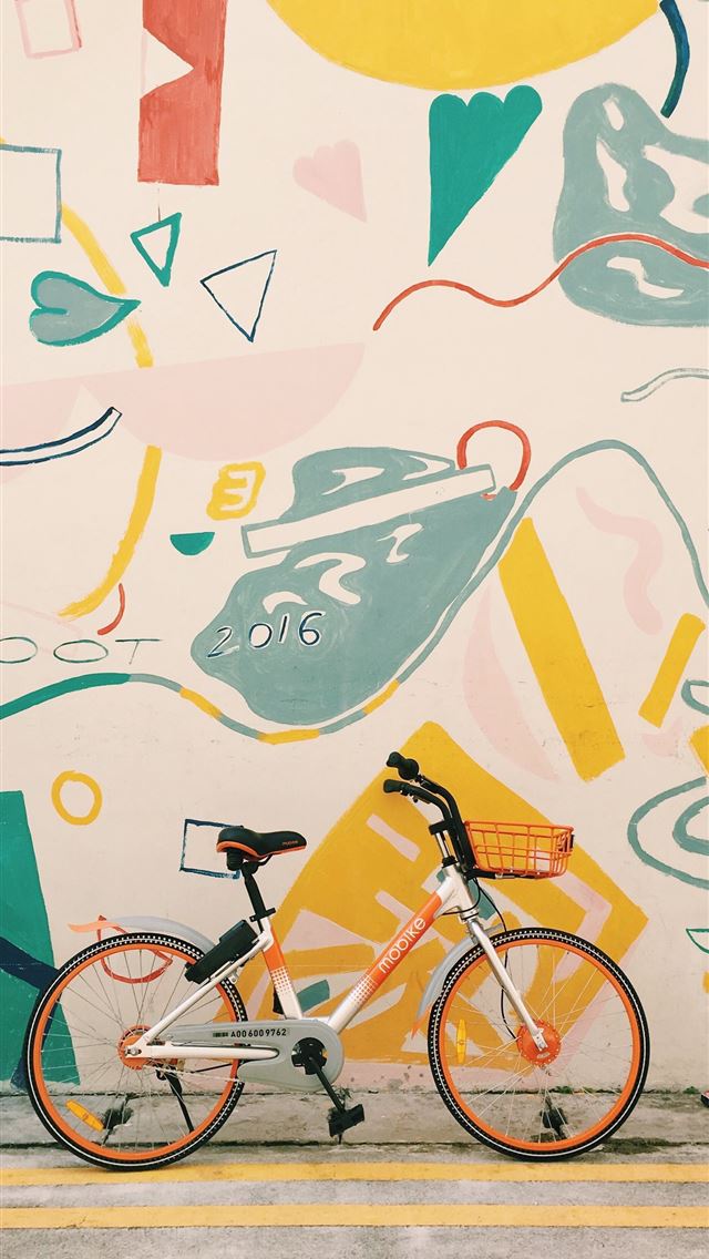640x1136 photography of orange and white bicycle - singapore iPhone Wallpaper