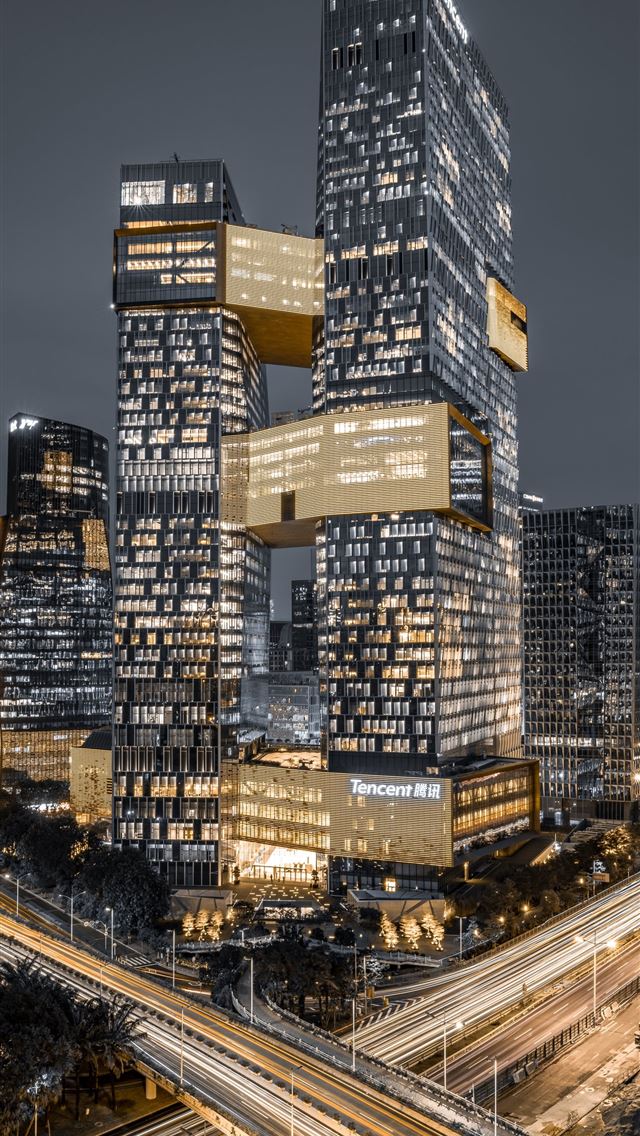 640x1136 lighted high rise buildings at nighttime - road iPhone Wallpaper