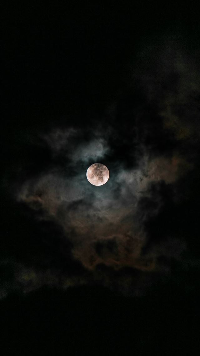 moon covered with clouds at nighttime iPhone wallpaper 