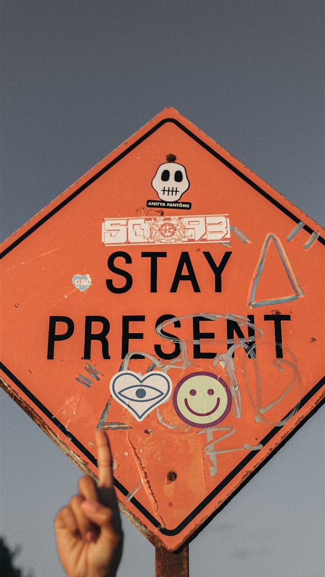 640x1136 person pointing Stay Present road sign during dayt... - mexico iPhone Wallpaper