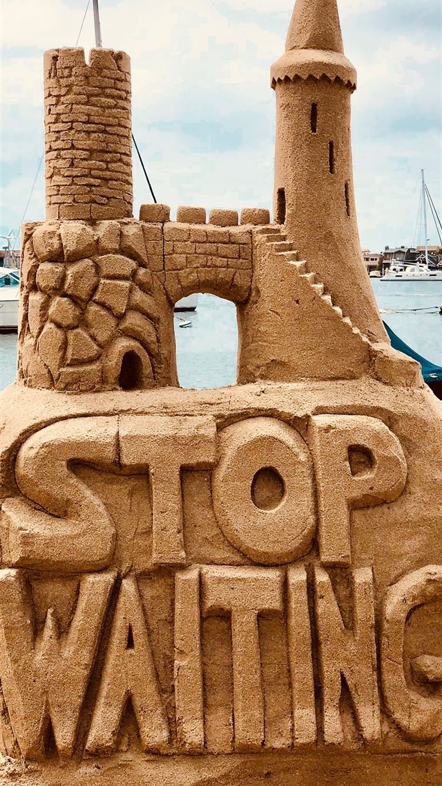 640x1136 sand castle beside body of water - united states iPhone Wallpaper