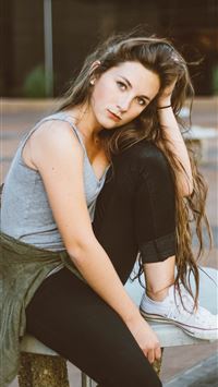 woman sitting on picnic table wallpaper