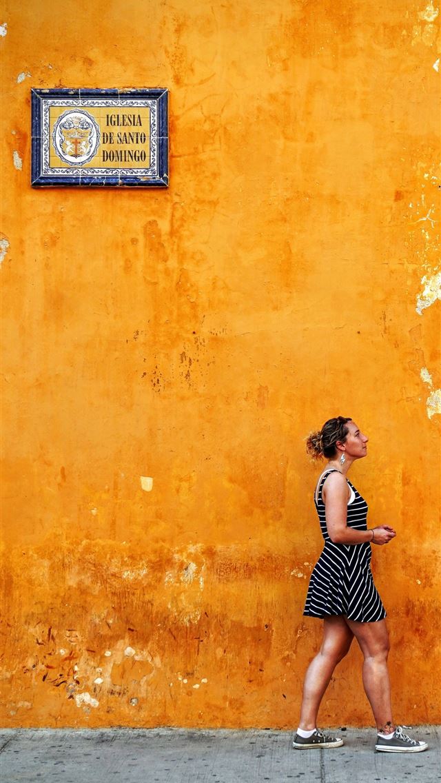 640x1136 woman walking on sidewalk - orange iPhone Wallpaper