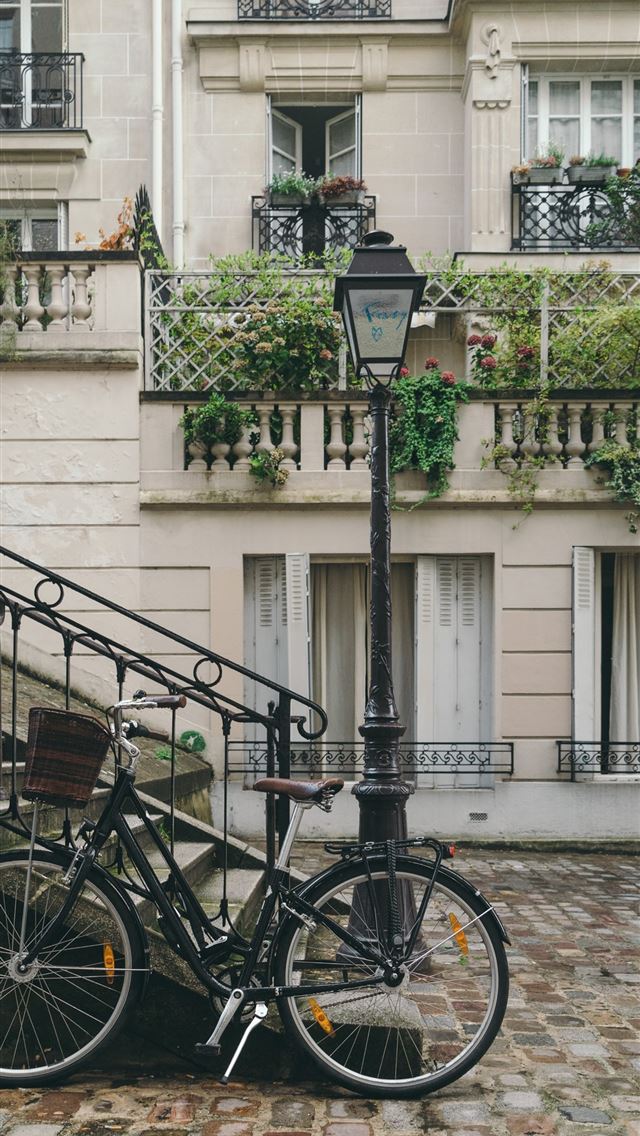 640x1136 bike leaning against handrail in front of concrete... - france iPhone Wallpaper