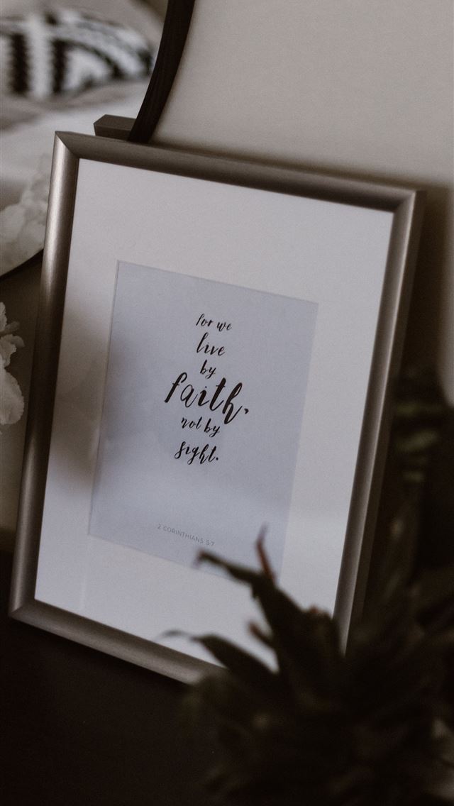 640x1136 photo frame beside flowers - bible iPhone Wallpaper