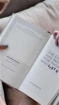 person reading an open book wallpaper