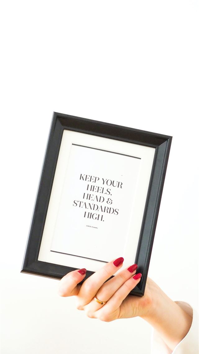 640x1136 person holding black framed white arabic text - quotes iPhone Wallpaper