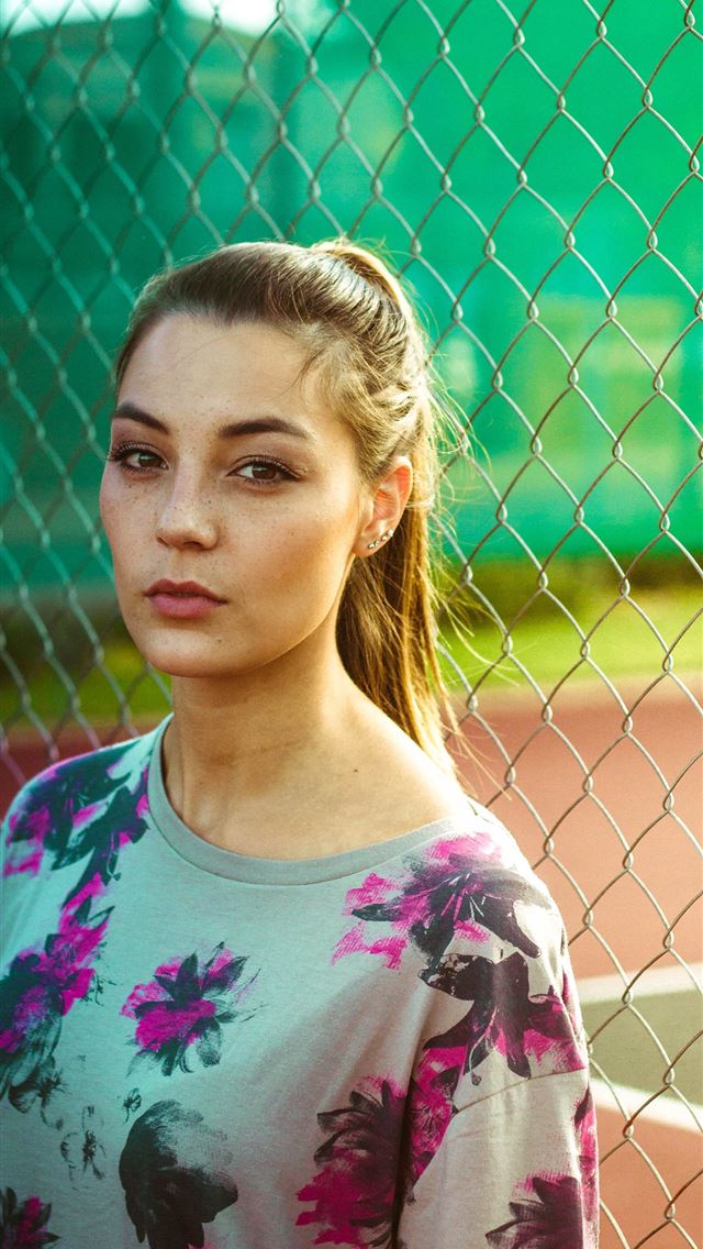 640x1136 woman wearing floral top beside chain link fence d... - south africa iPhone Wallpaper