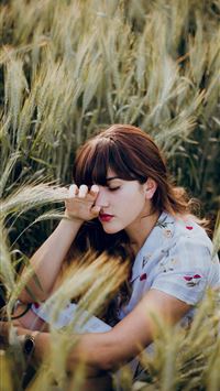 woman sitting on grass wallpaper