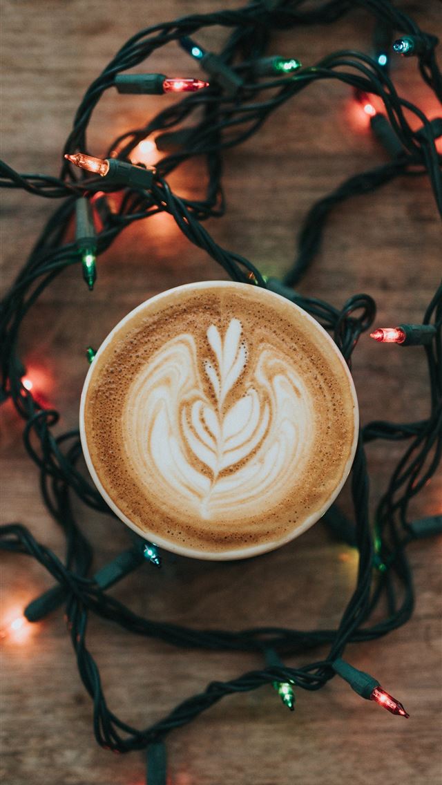 640x1136 cup of cappuccino and turned on string lights on b... - holiday iPhone Wallpaper