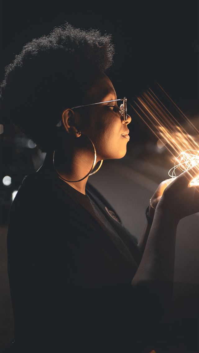640x1136 woman standing and holding string lights - brazil iPhone Wallpaper