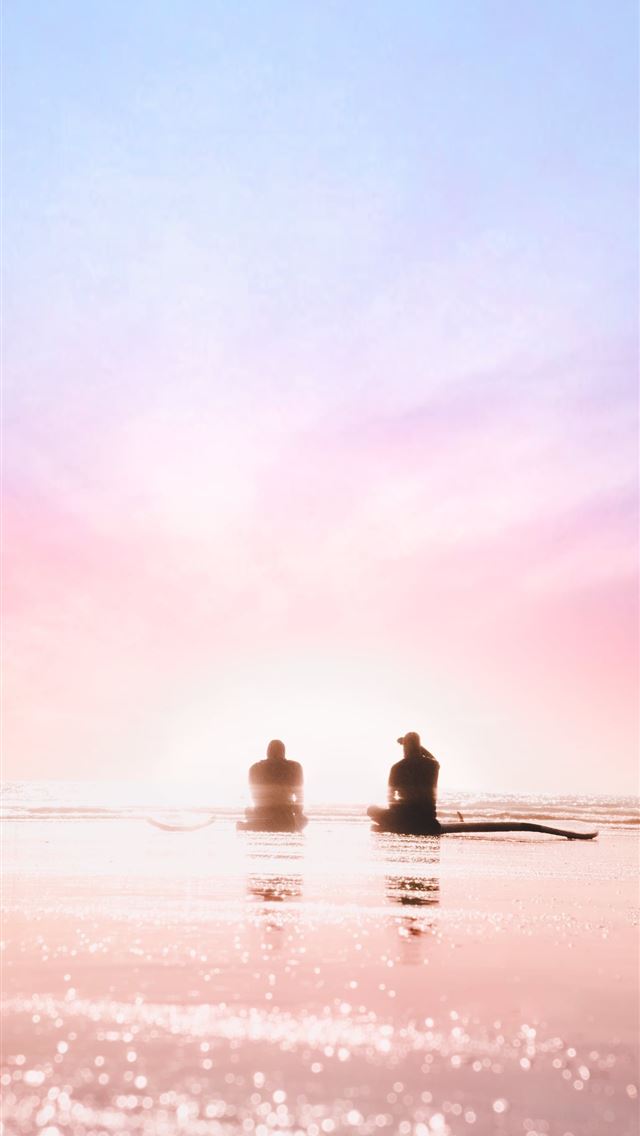 640x1136 silhouette of two person sitting on seashore durin... - canada iPhone Wallpaper