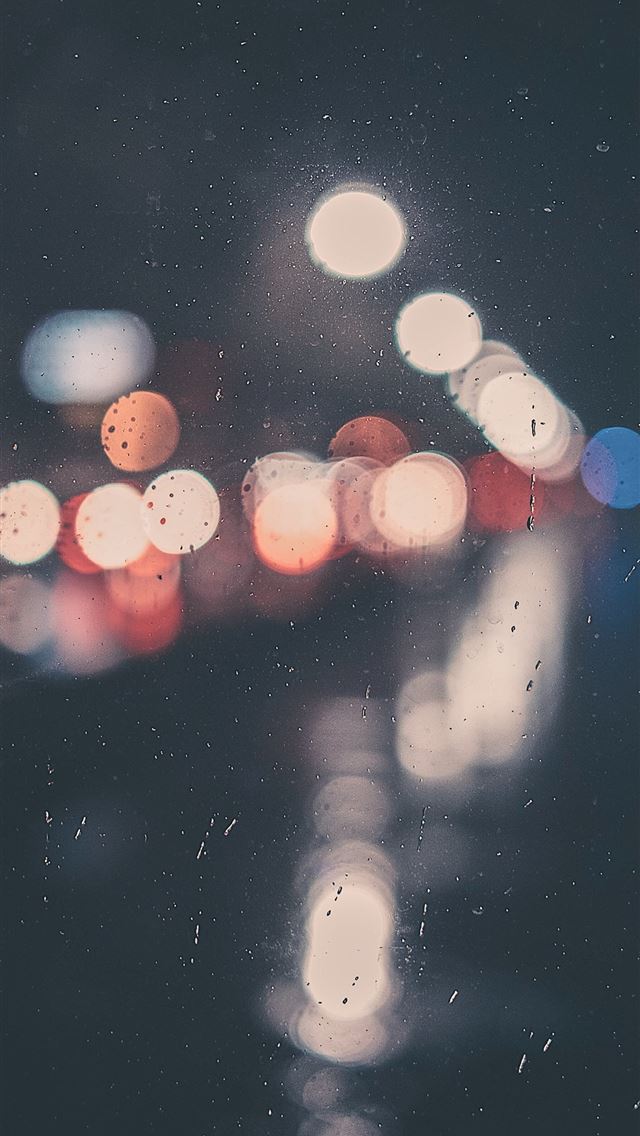 bokeh photography of clear glass panel with light iPhone wallpaper 