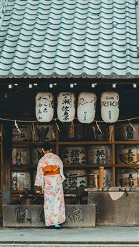woman wearing orange and white kimono dress standi... wallpaper