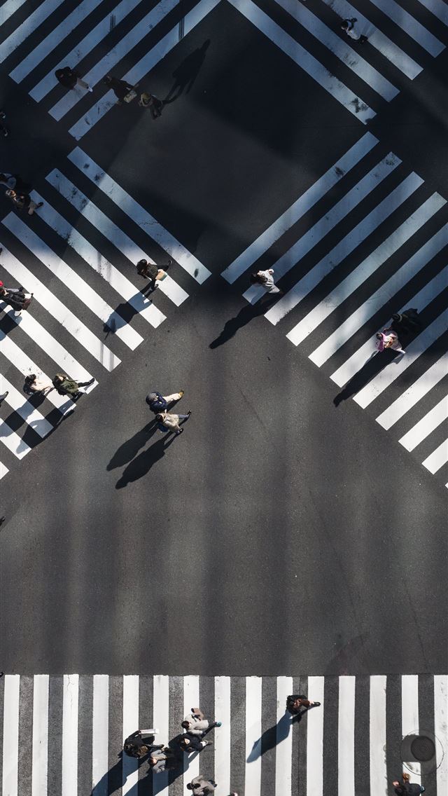 aerial photography of people walking in the inters... iPhone wallpaper 