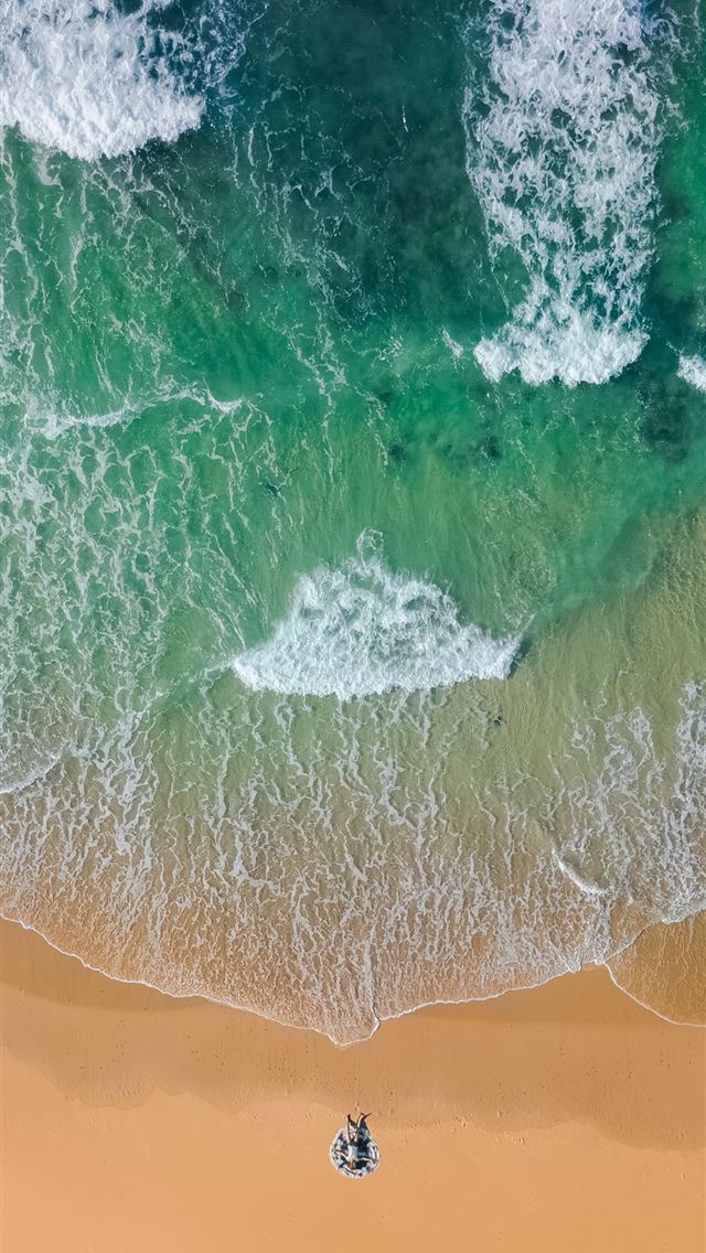 640x1136 top view photography of brown sand on beach with t... - gold coast iPhone Wallpaper