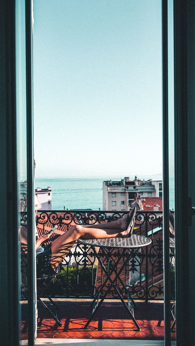 640x1136 person sitting on balcony - france iPhone Wallpaper