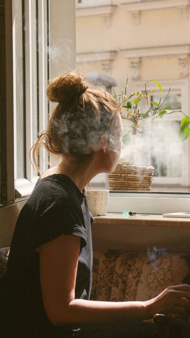 640x1136 woman smoking while look through the window - germany iPhone Wallpaper