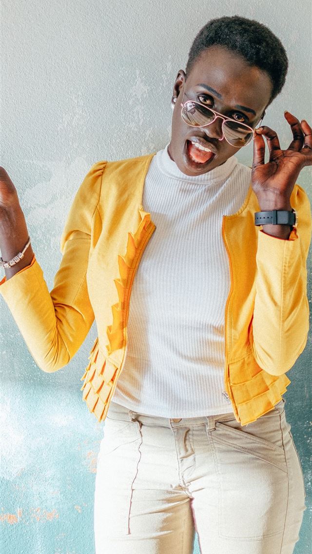 640x1136 woman in yellow jacket holding ice cream - spring iPhone Wallpaper