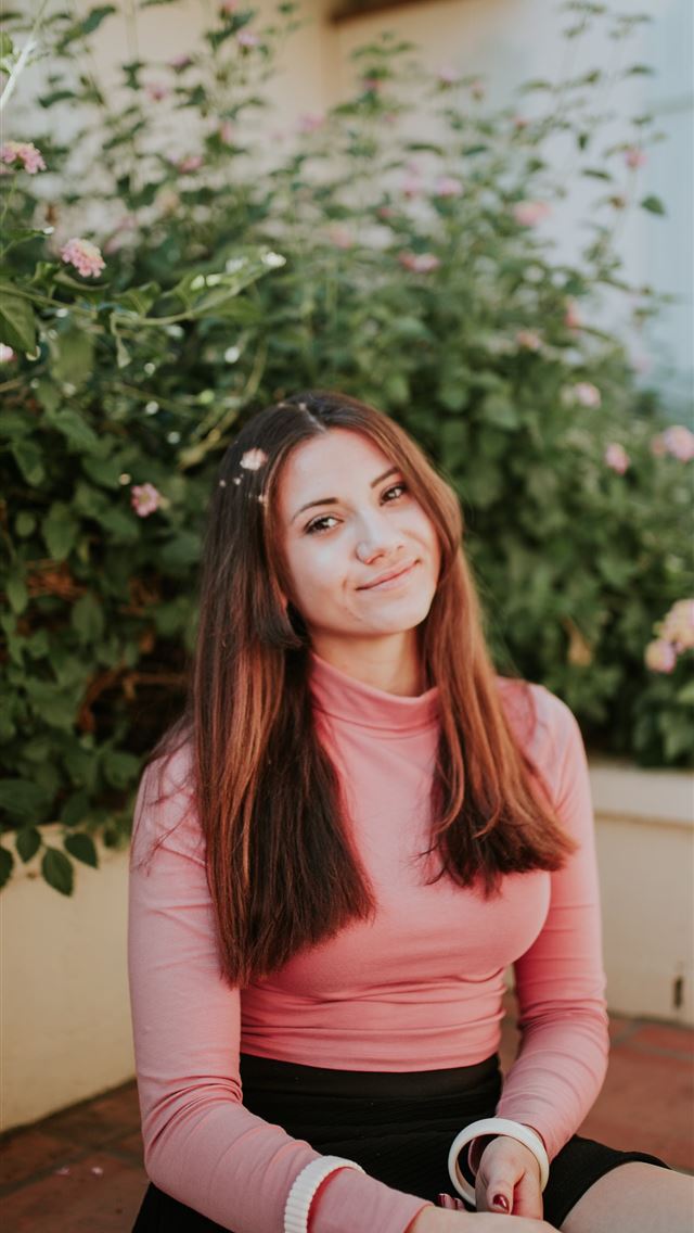 640x1136 woman sitting near pink flowers at daytime - spring iPhone Wallpaper
