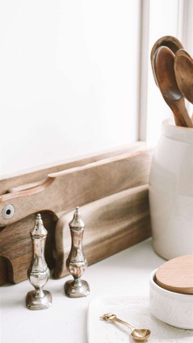 640x1136 brown wooden spoons on ceramic canister on white t... -  iPhone Wallpaper