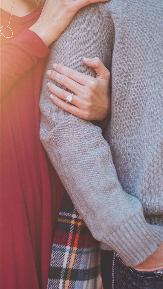 640x1136 woman holding the shoulder of man - love iPhone Wallpaper