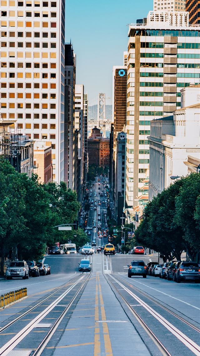 gray concrete city road during daytime iPhone wallpaper 