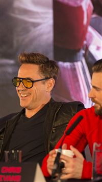 Robert Downey Jr and Chris Evans at the Avengers A... wallpaper