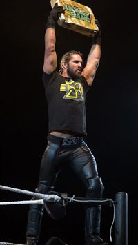 File Seth Rollins holds Money in the Bank briefcas... wallpaper