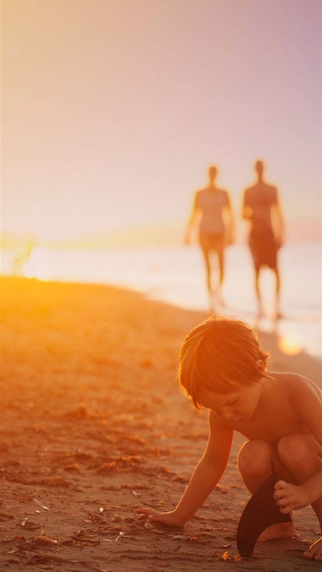 1284x2778 boy playing sand on seashore during sunset - sunshine iPhone Wallpaper