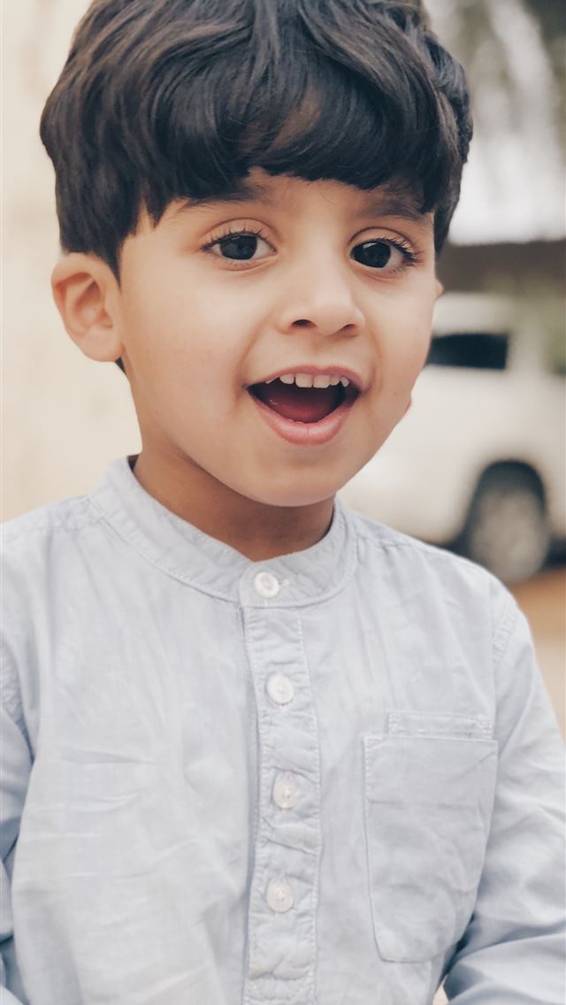 1284x2778 boy in white dress shirt smiling - pure iPhone Wallpaper