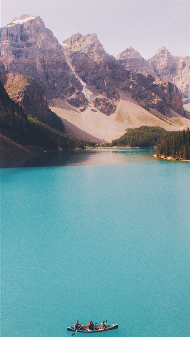 1284x2778 three people paddling in canoe - lake iPhone Wallpaper