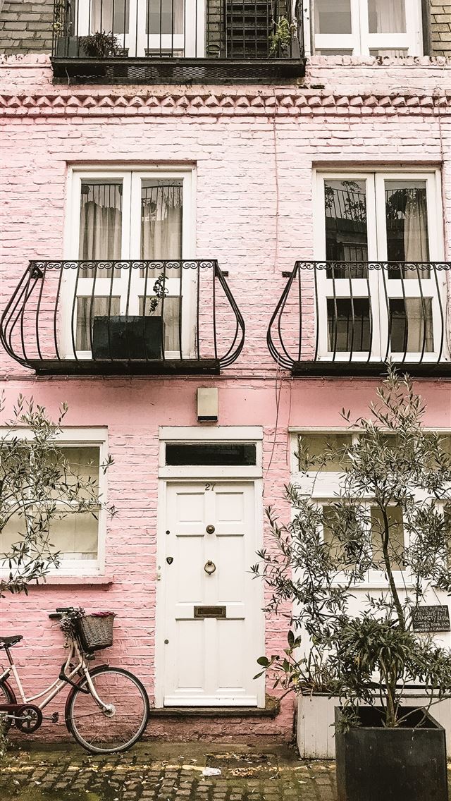 1284x2778 bicycle beside pink wall - united kingdom iPhone Wallpaper