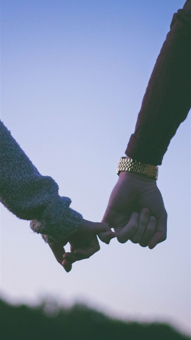 1284x2778 man and woman holding hand using pinky fingers - love iPhone Wallpaper