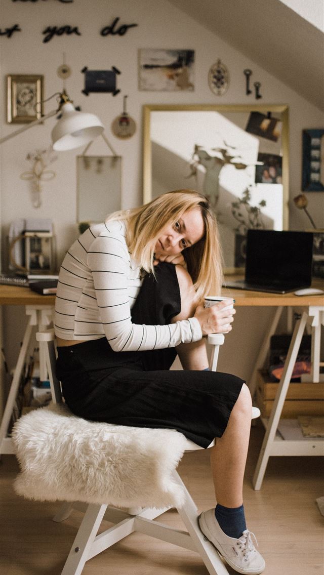 1284x2778 woman sitting on stool resting her head on her kne... - girl iPhone Wallpaper