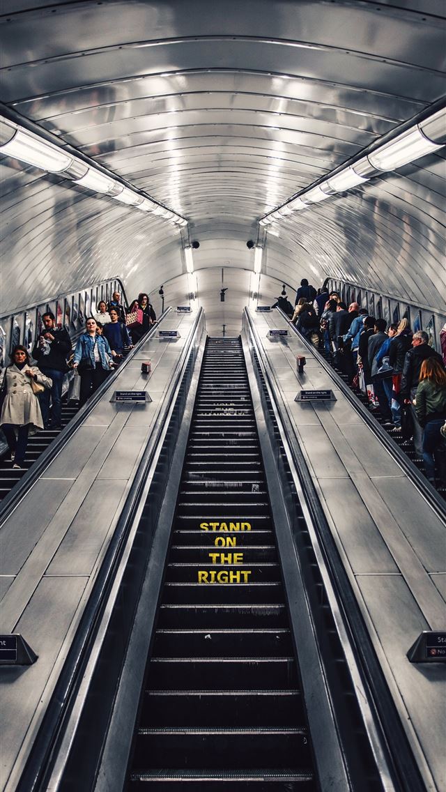 1284x2778 people riding escalator - london iPhone Wallpaper