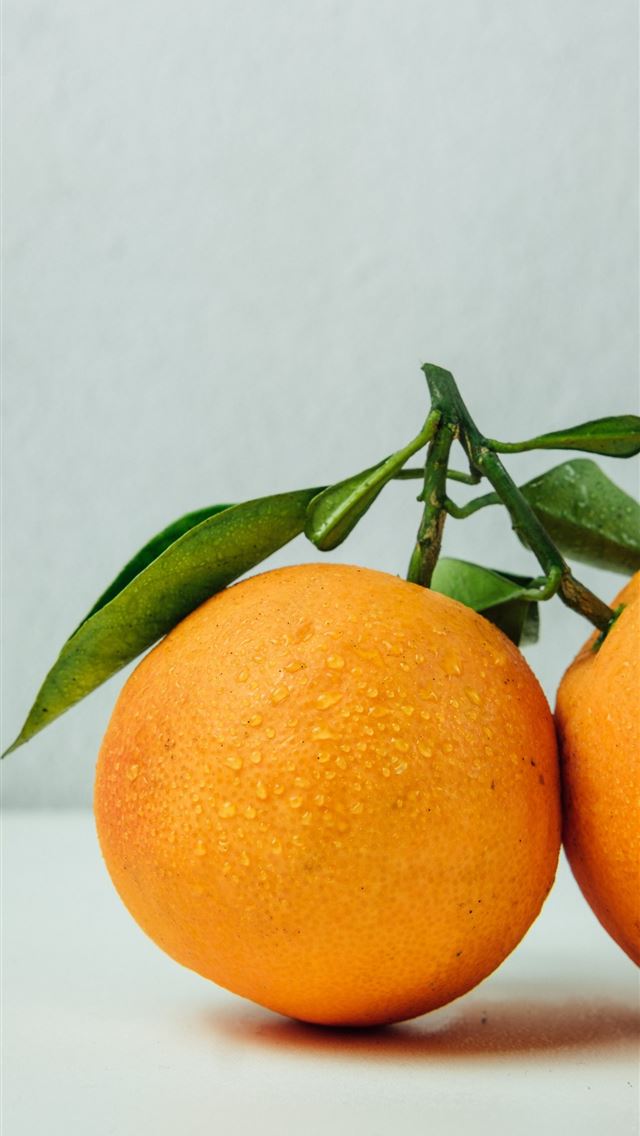 1284x2778 two orange fruits on table - food iPhone Wallpaper