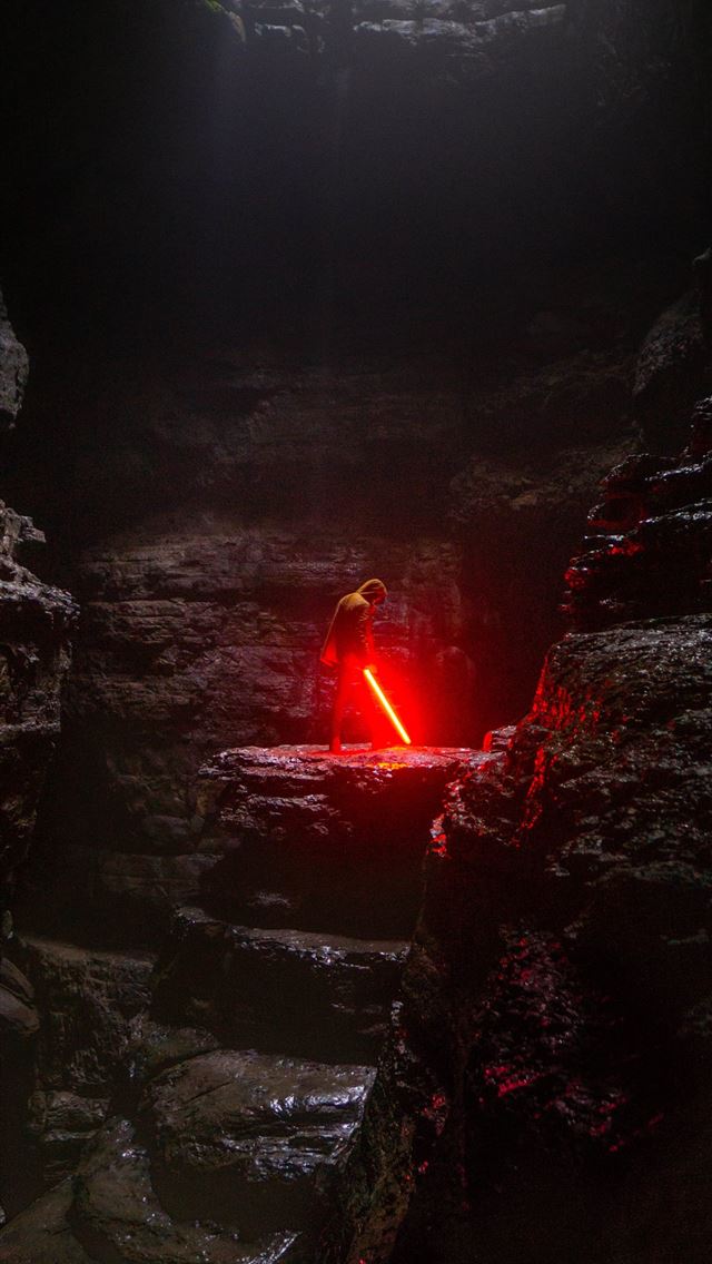 1284x2778 person holding red lightsaber - star iPhone Wallpaper
