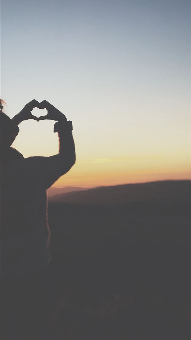 1284x2778 silhouette of a person making heart using her hand... - united kingdom iPhone Wallpaper