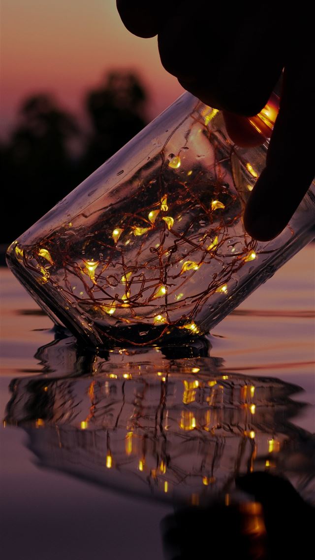 1284x2778 person holding string lights on clear glass jar ab... - lights iPhone Wallpaper