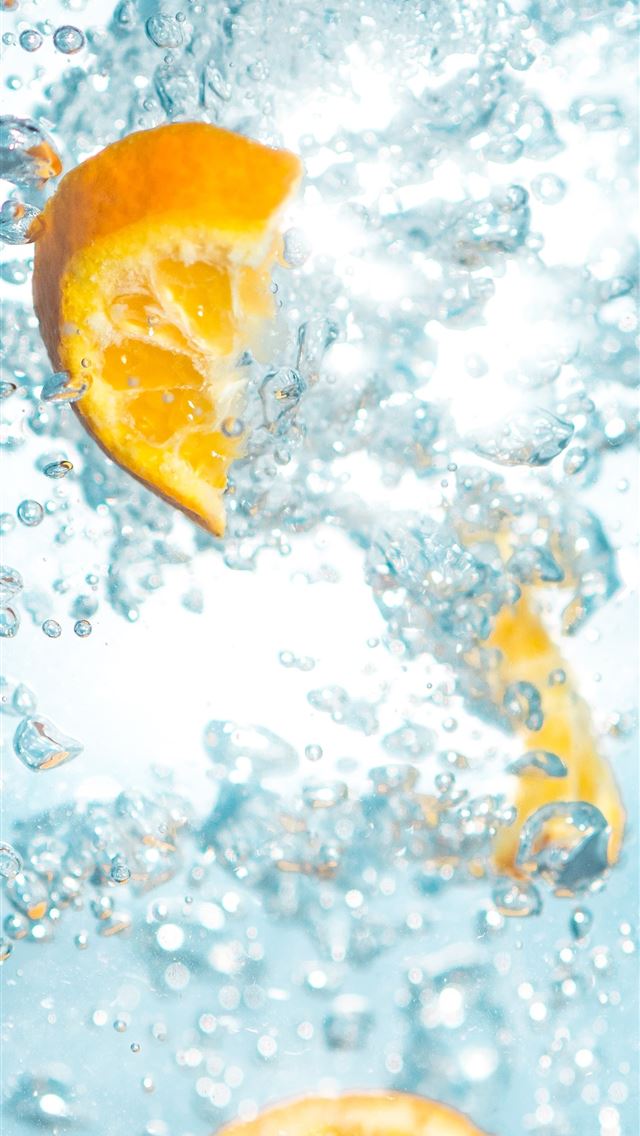 1284x2778 sliced orange fruits underwater - health iPhone Wallpaper