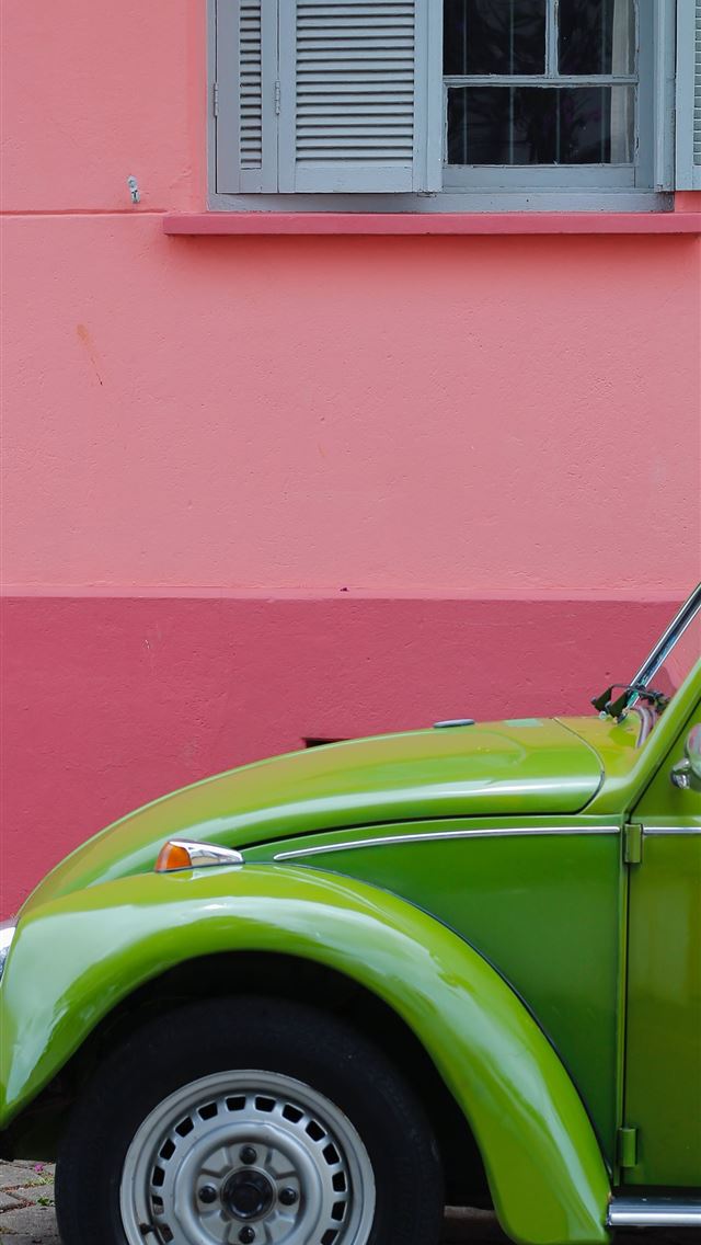 1284x2778 green Volkswagen beetle beside of pink building - green iPhone Wallpaper