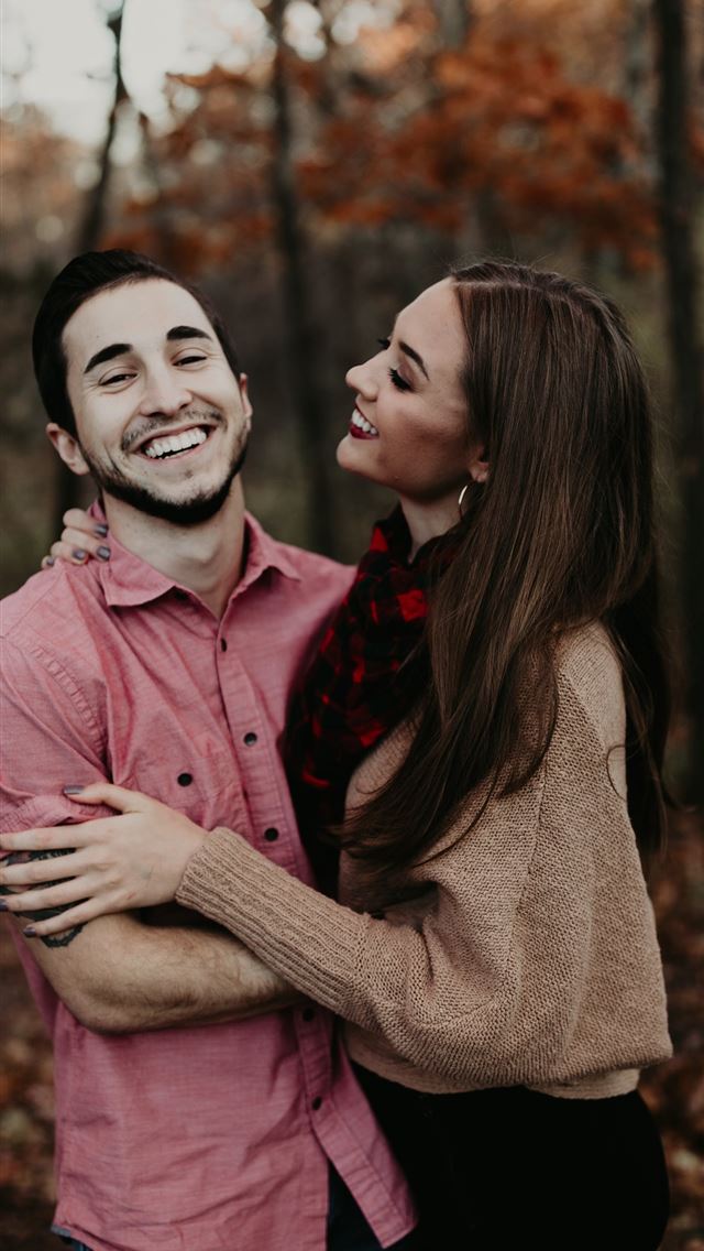 1284x2778 woman hugging man selective focus photography - st. louis iPhone Wallpaper