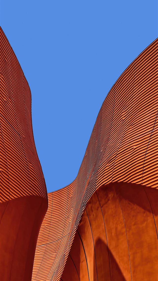 1284x2778 minimalist photography of brown wavy structure - building iPhone Wallpaper