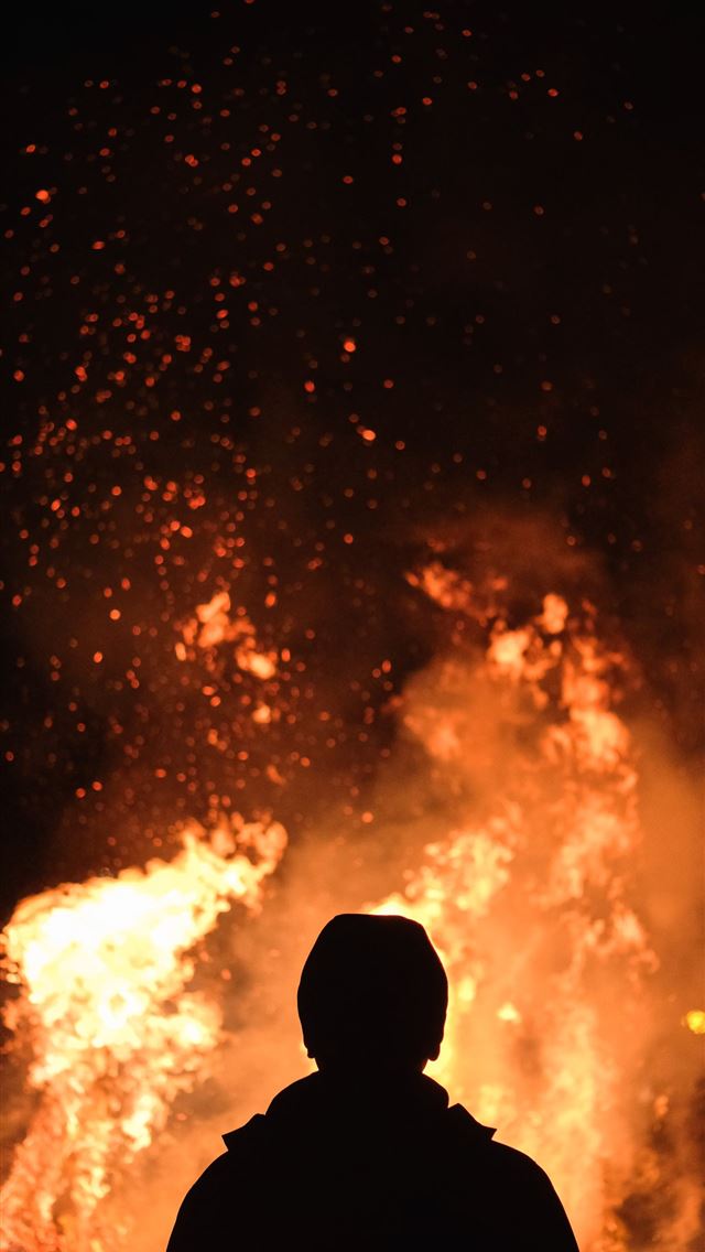 1284x2778 person standing in front of fire - fire iPhone Wallpaper