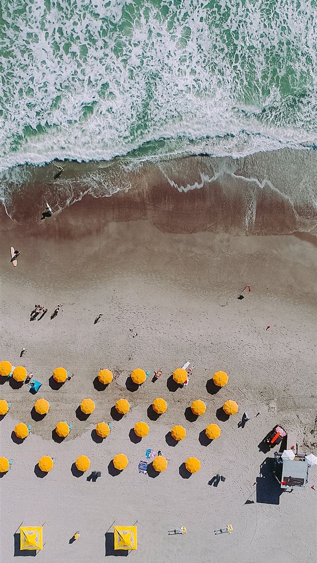 1284x2778 aerial photography of umbrellas on beach - yellow iPhone Wallpaper