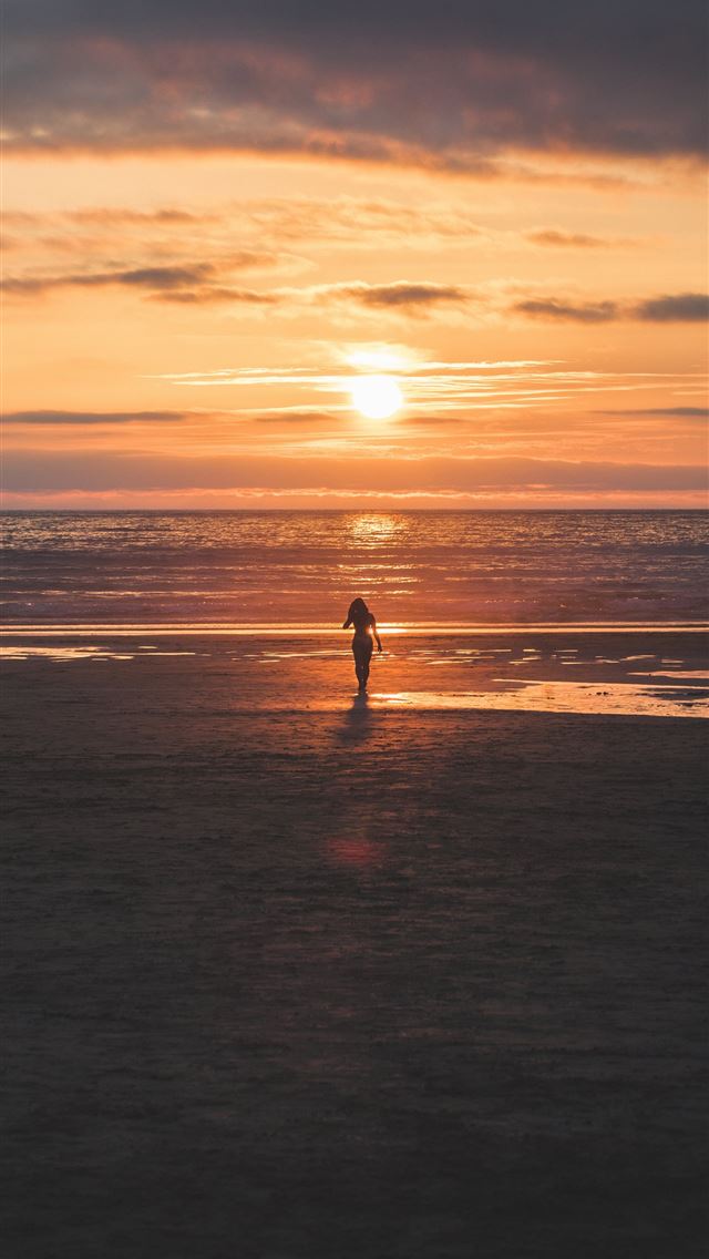 640x1136 silhouette of woman standing on seashore -  iPhone Wallpaper