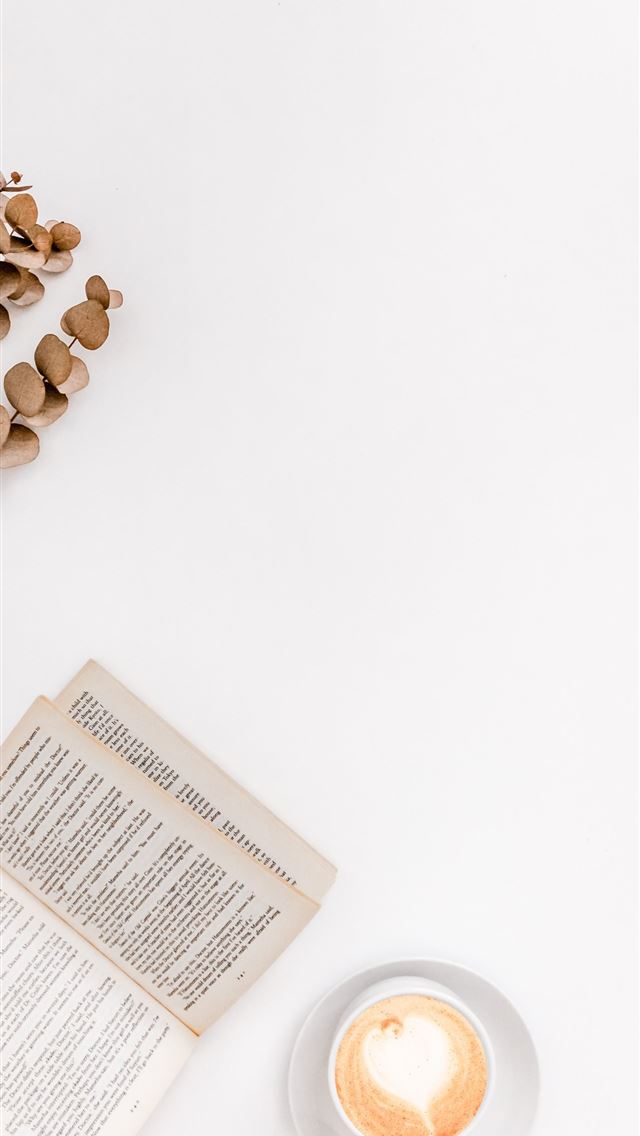 1284x2778 white ceramic mug beside white book - south africa iPhone Wallpaper