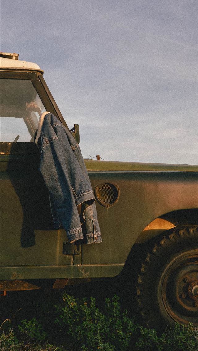 1284x2778 blue denim jacket on vehicle mirror - greece iPhone Wallpaper